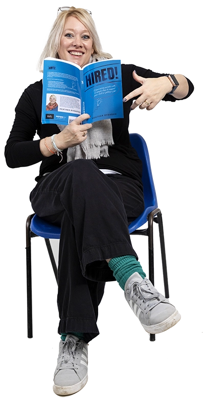 Heather, holding her book 'Hired!'